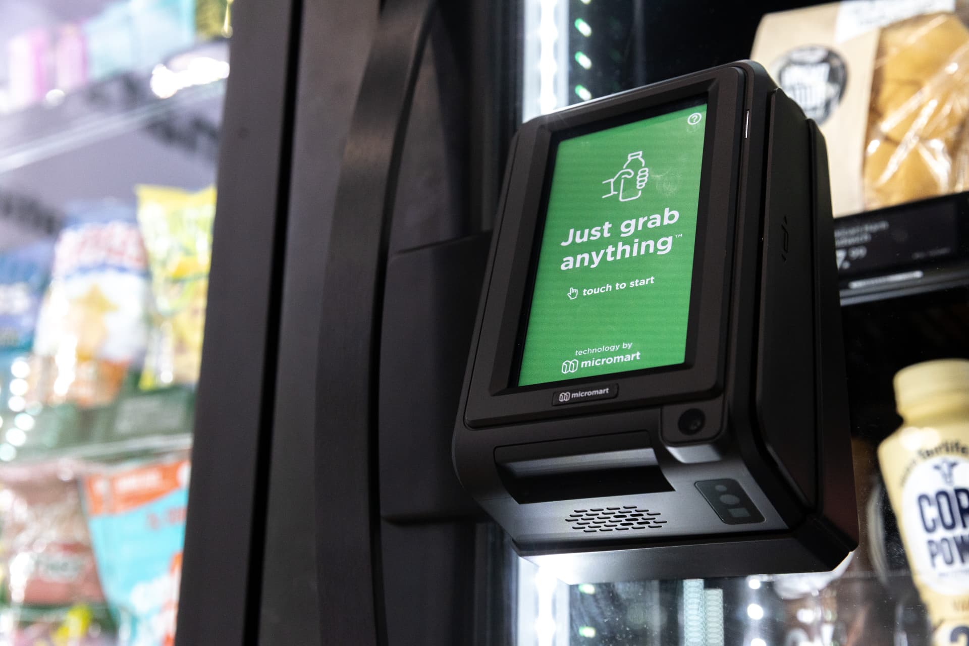 Smart store touchscreen checkout terminal reading Just grab anything